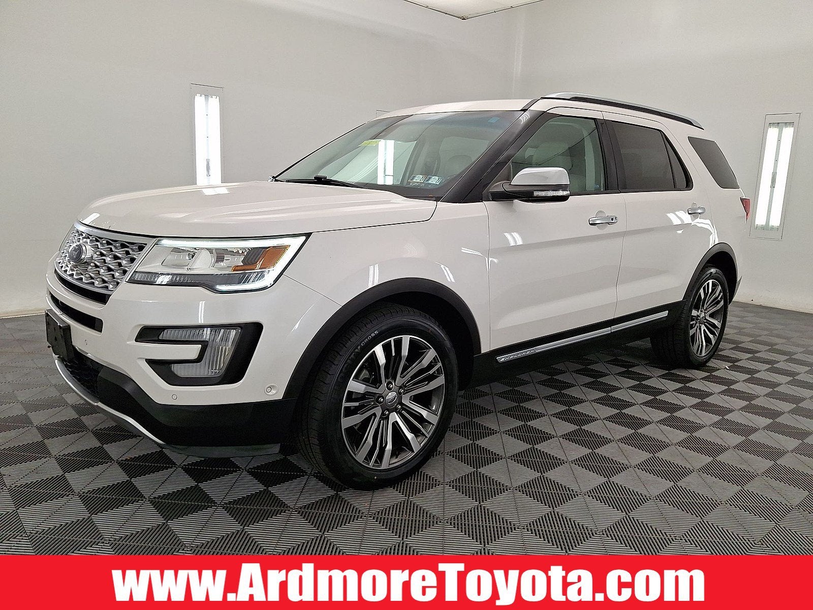 2016 Ford Explorer Platinum in White — front three-quarter view