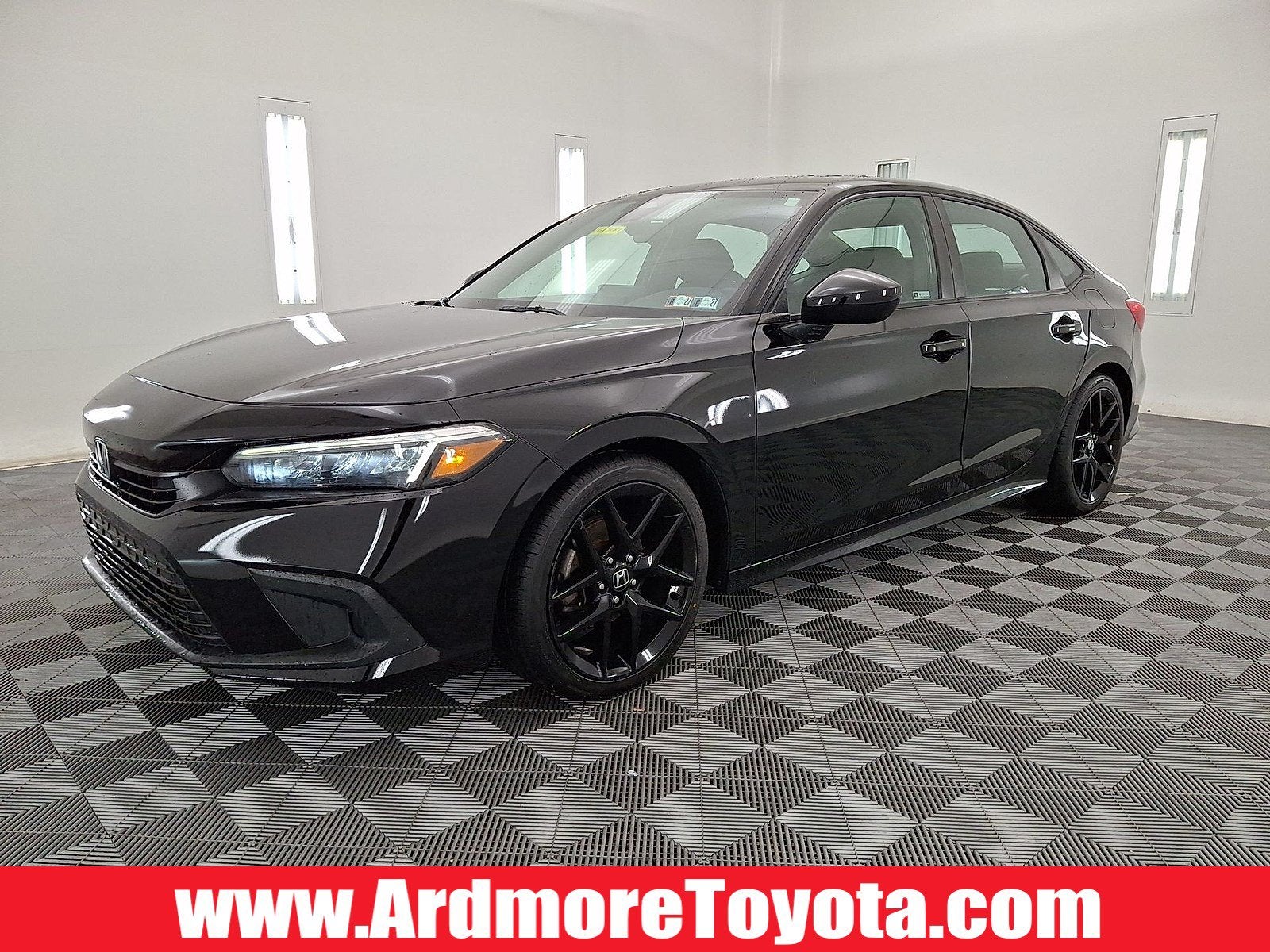 2022 Honda Civic Sport in Crystal Black Pearl — front three-quarter view
