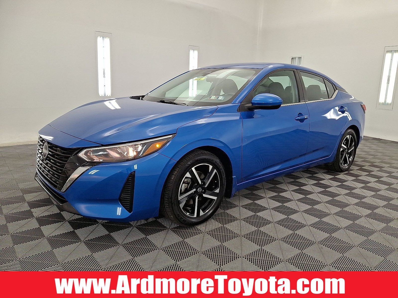 2024 Nissan Sentra SV in Electric Blue Metallic — front three-quarter view