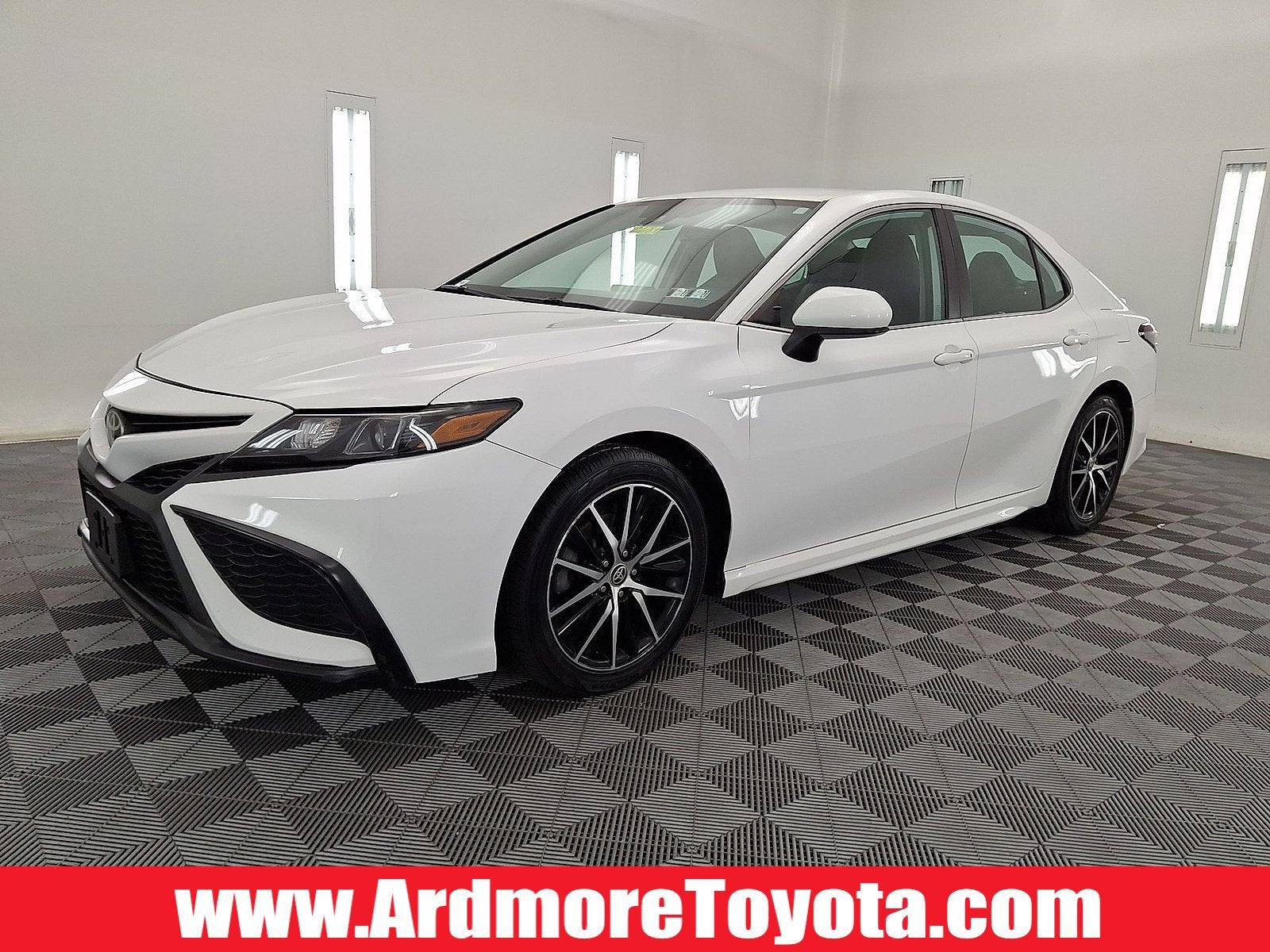2021 Toyota Camry SE in Super White — front three-quarter view