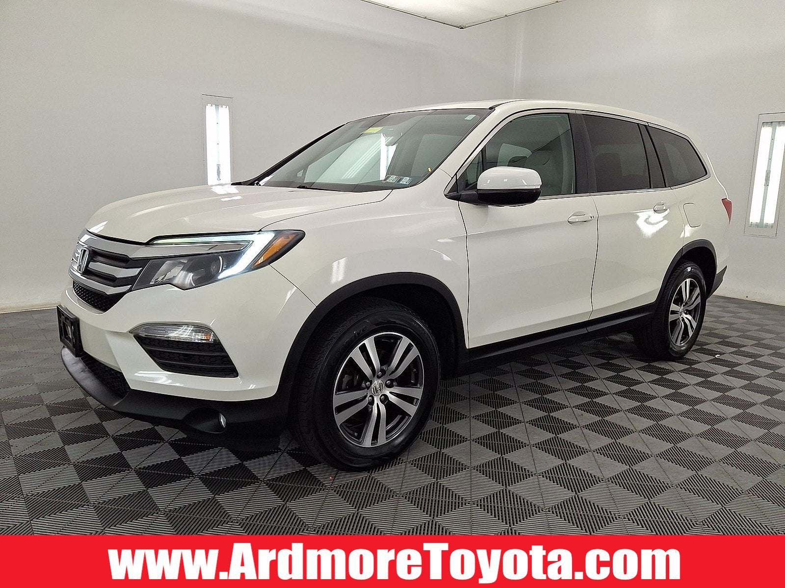 2016 Honda Pilot EX-L in White Diamond Pearl — front three-quarter view