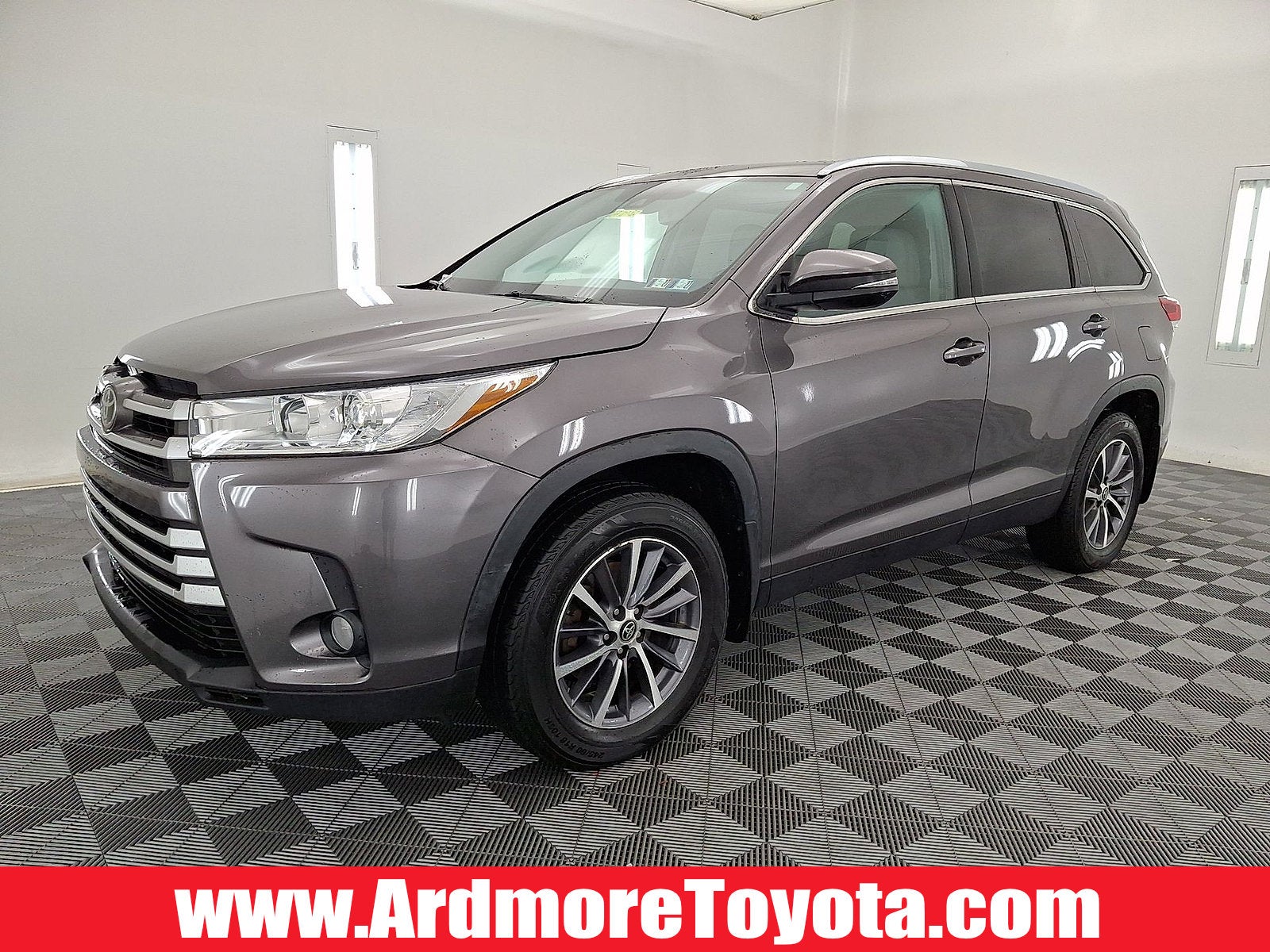 2019 Toyota Highlander XLE in Predawn Gray Mica — front three-quarter view