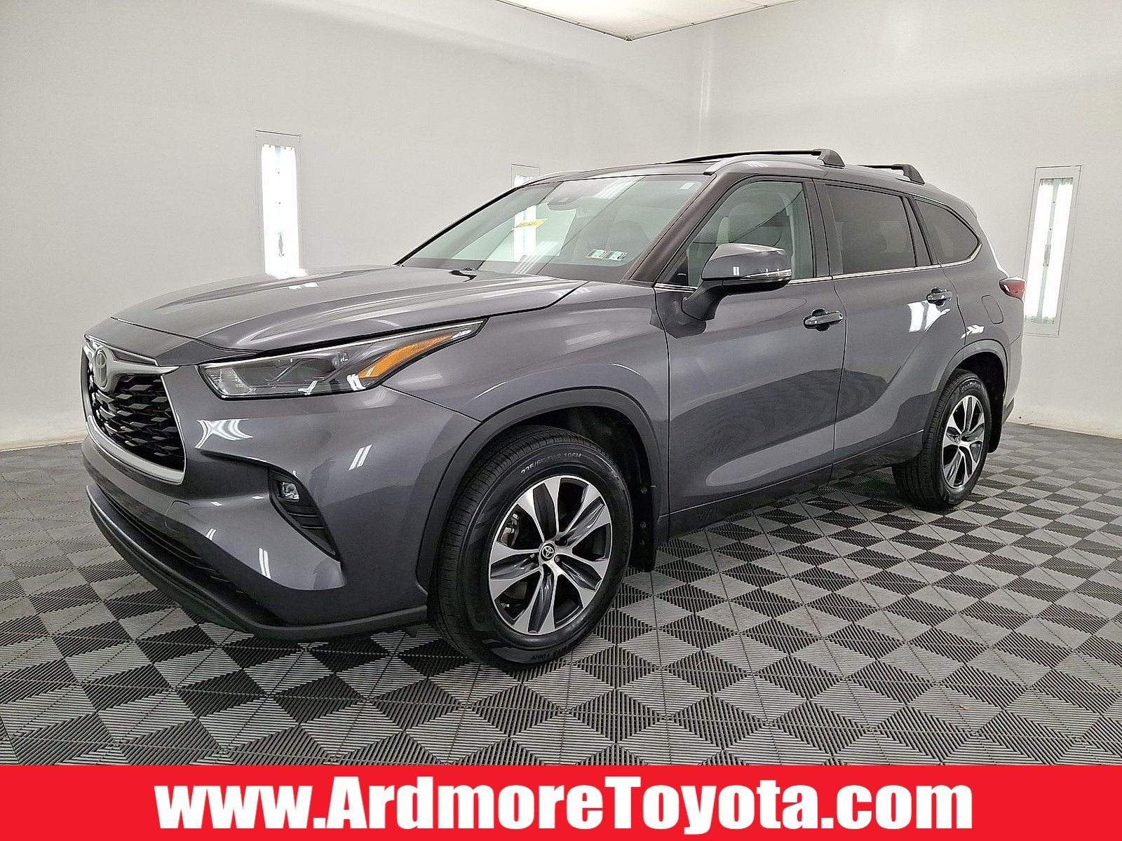 2023 Toyota Highlander XLE in Magnetic Gray Metallic — front three-quarter view
