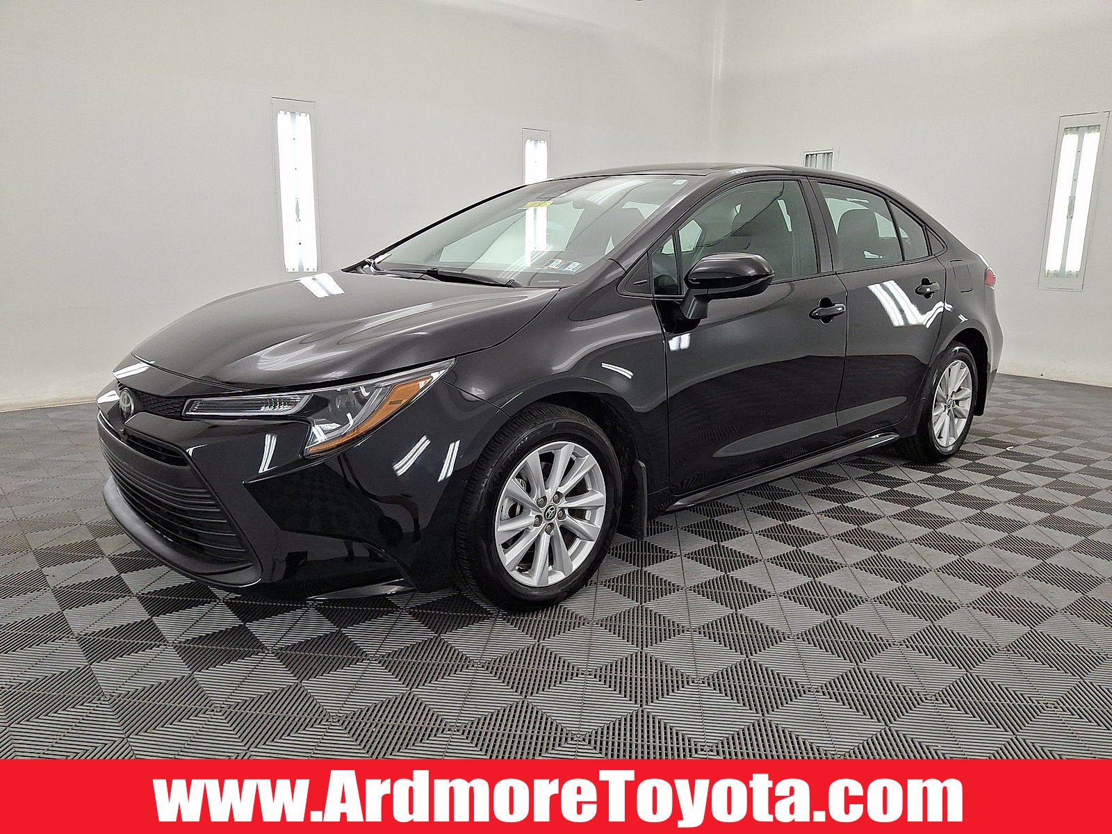 2025 Toyota Corolla LE in Midnight Black Metallic — front three-quarter view