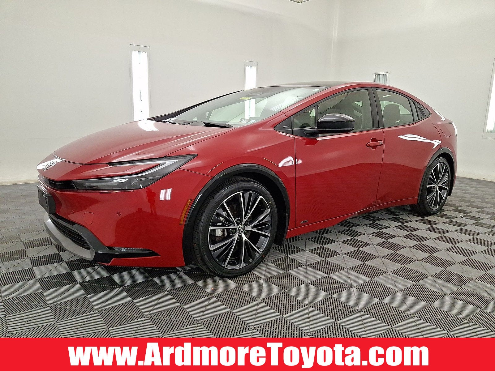 2024 Toyota Prius XLE in Supersonic Red — front three-quarter view