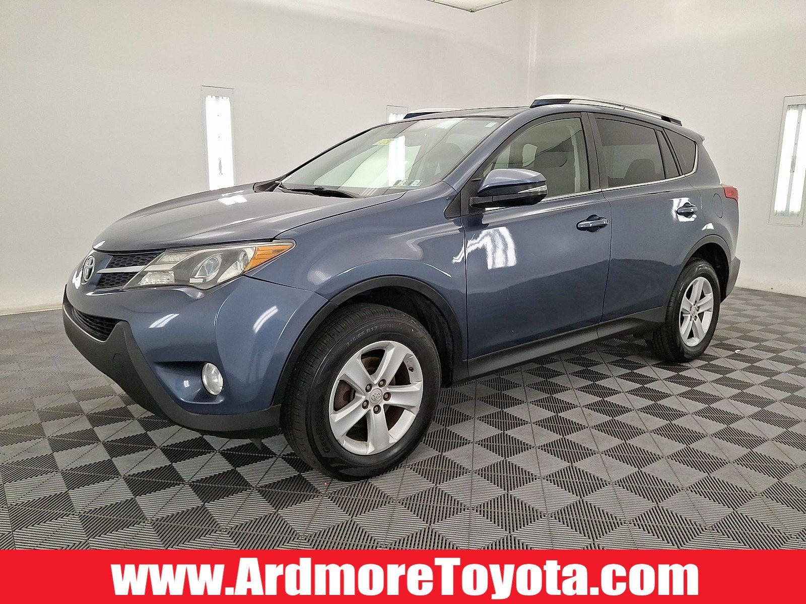 2014 Toyota RAV4 XLE in Shoreline Blue Metallic — front three-quarter view