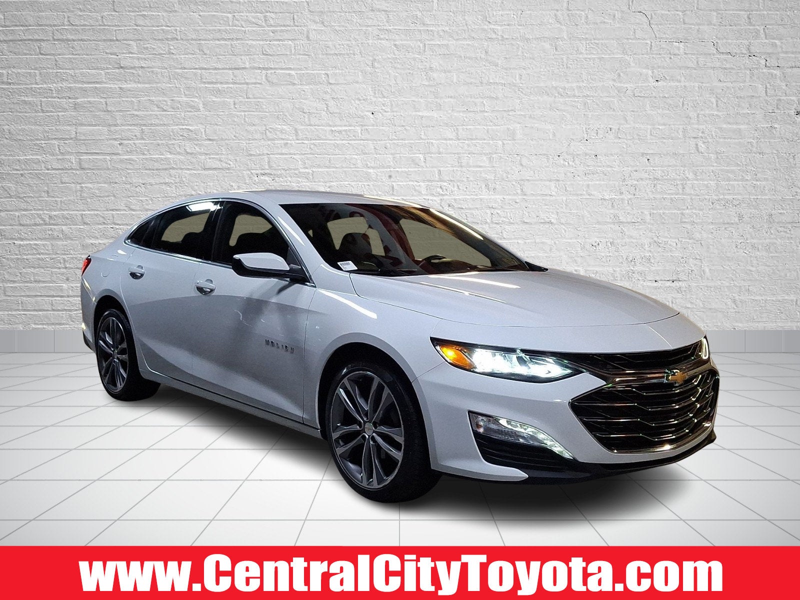 2024 Chevrolet Malibu LT in Summit White — front three-quarter view