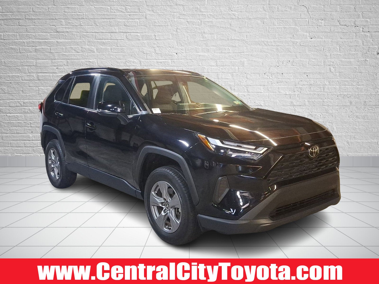 2023 Toyota RAV4 XLE in Midnight Black Metallic - 218 — front three-quarter view