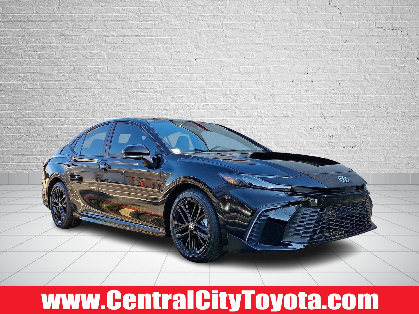 2026 Toyota Camry SE in Midnight Black Metallic — front three-quarter view