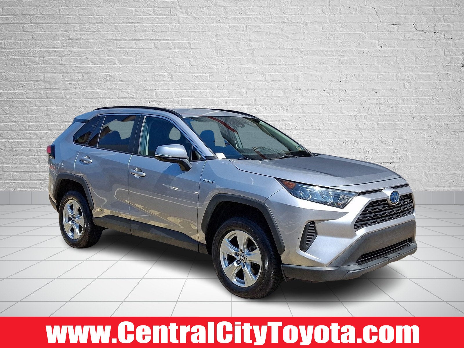 2021 Toyota RAV4 Hybrid LE in Silver Sky Metallic — front three-quarter view