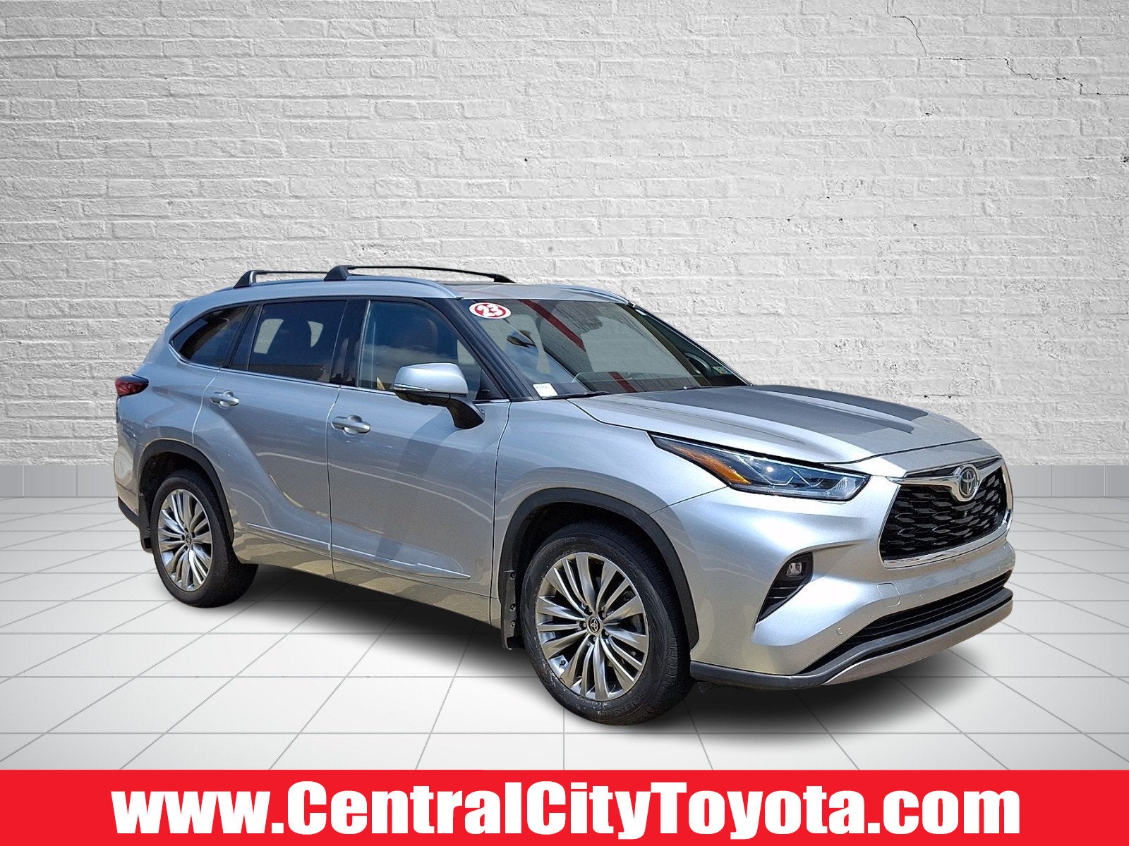 2023 Toyota Highlander Platinum in Celestial Silver Metallic — front three-quarter view