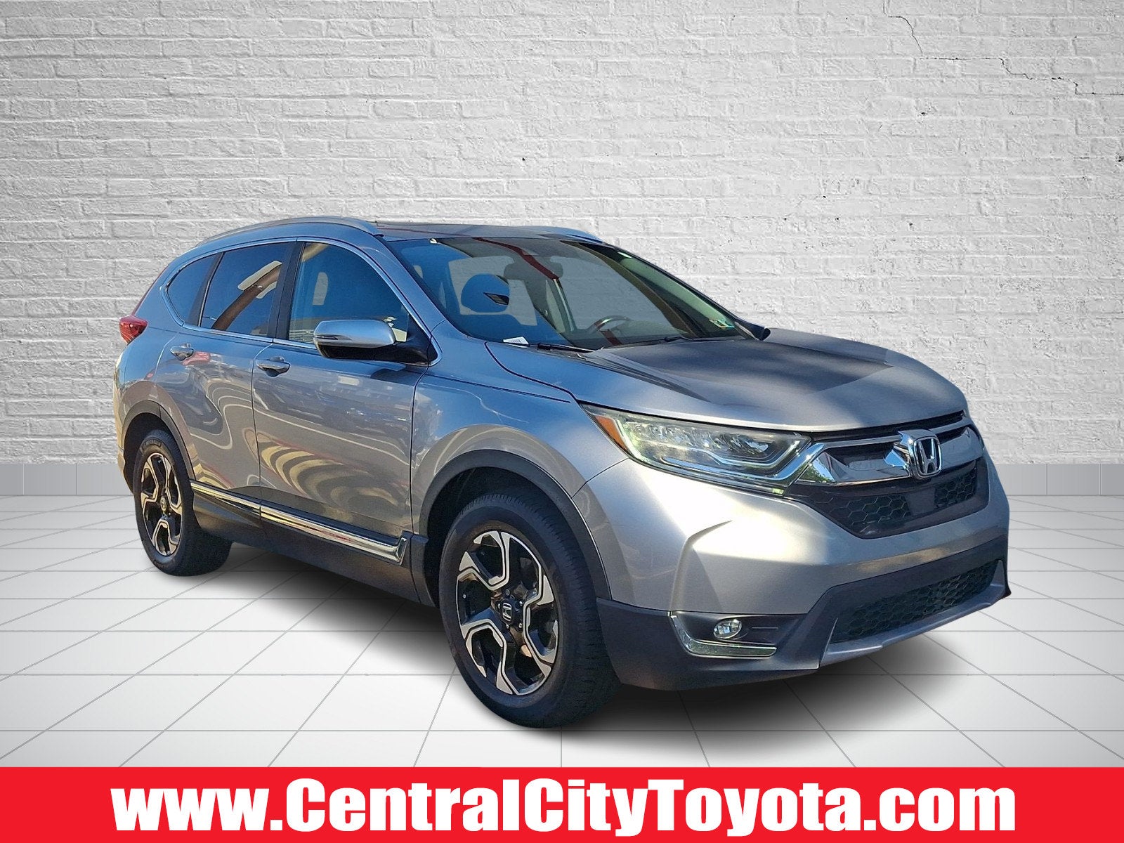 2019 Honda CR-V Touring in Lunar Silver Metallic — front three-quarter view
