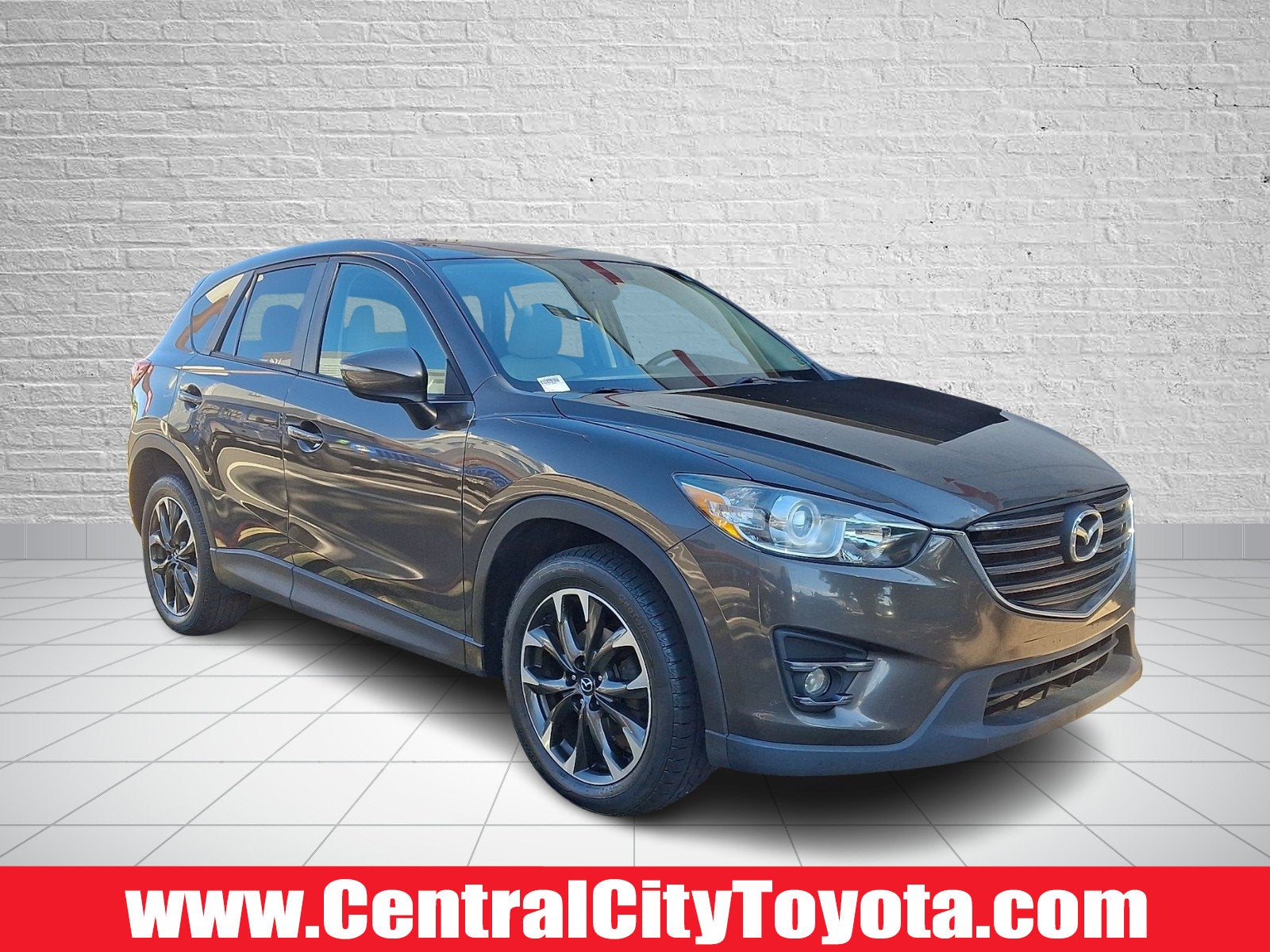 2016 Mazda Mazda CX-5 Grand Touring in Titanium Flash Mica — front three-quarter view