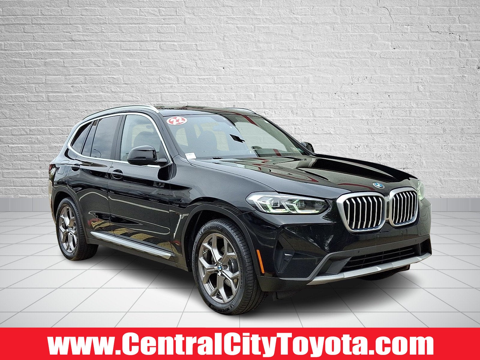 2022 BMW X3 xDrive30i in Jet Black — front three-quarter view